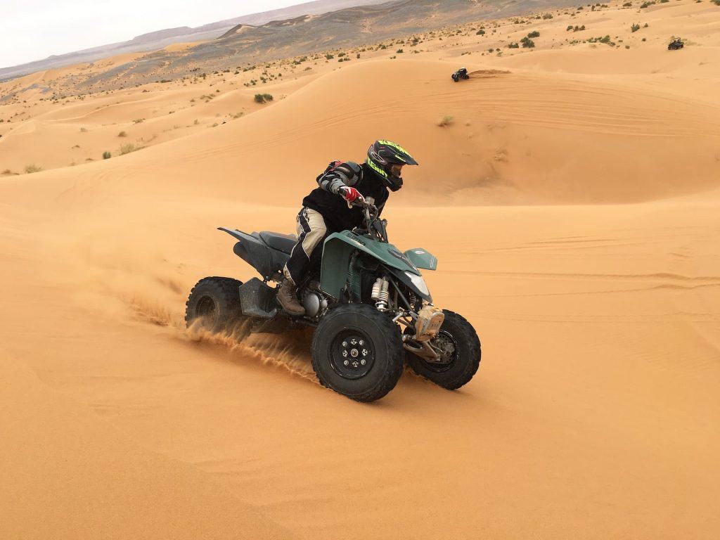 Quadbike on desert dune